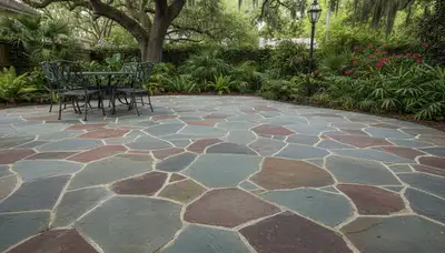 Flagstone patio with natural slate pavers installed by landscaping experts in New Orleans, LA